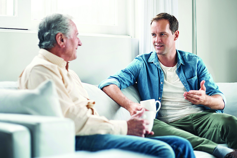 young-man-and-his-elderly-father-chating-over-coffee-on-sofa Later-Life Entrepreneurship